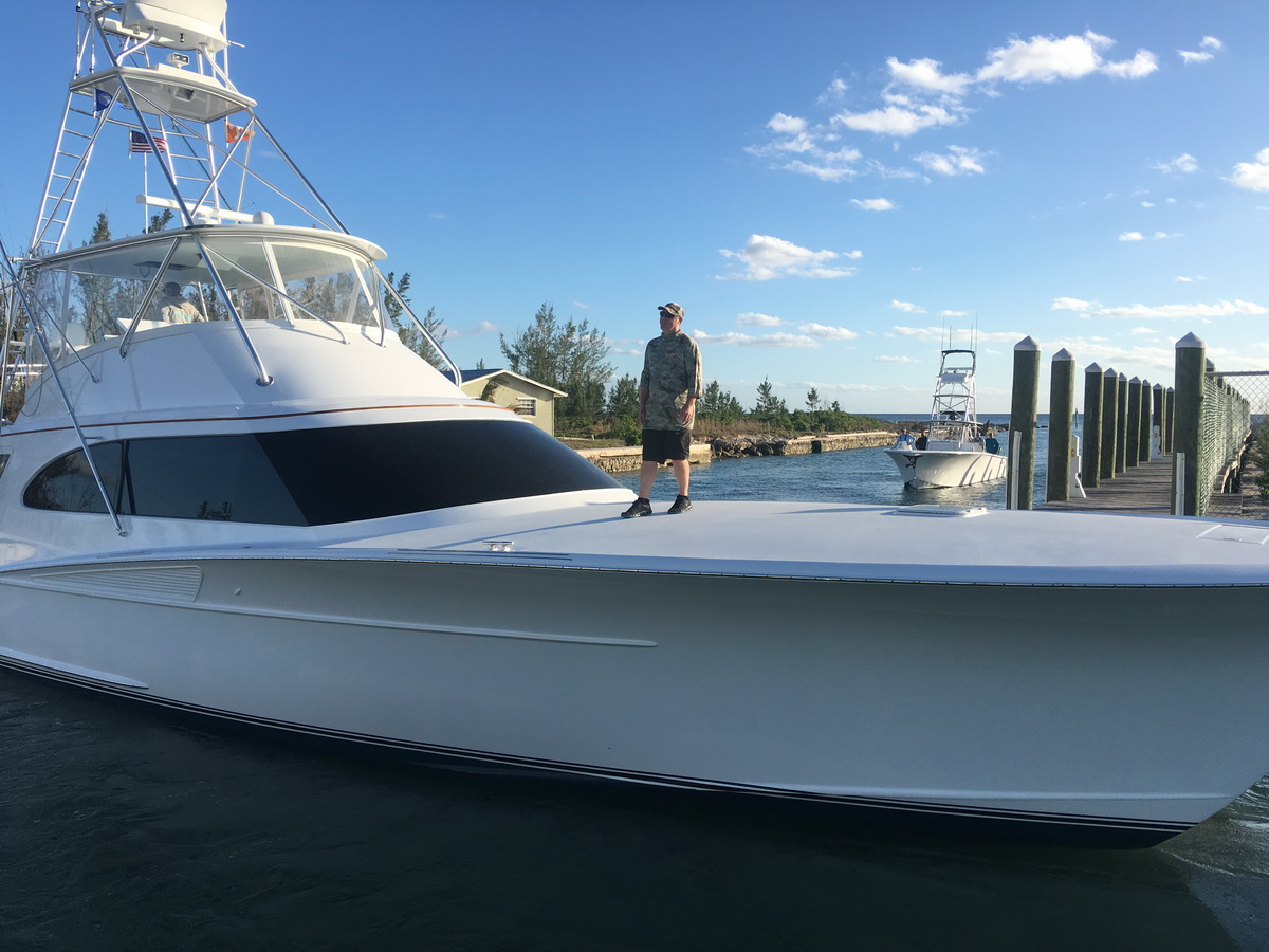 man standing on blue marlin cove fishing boat