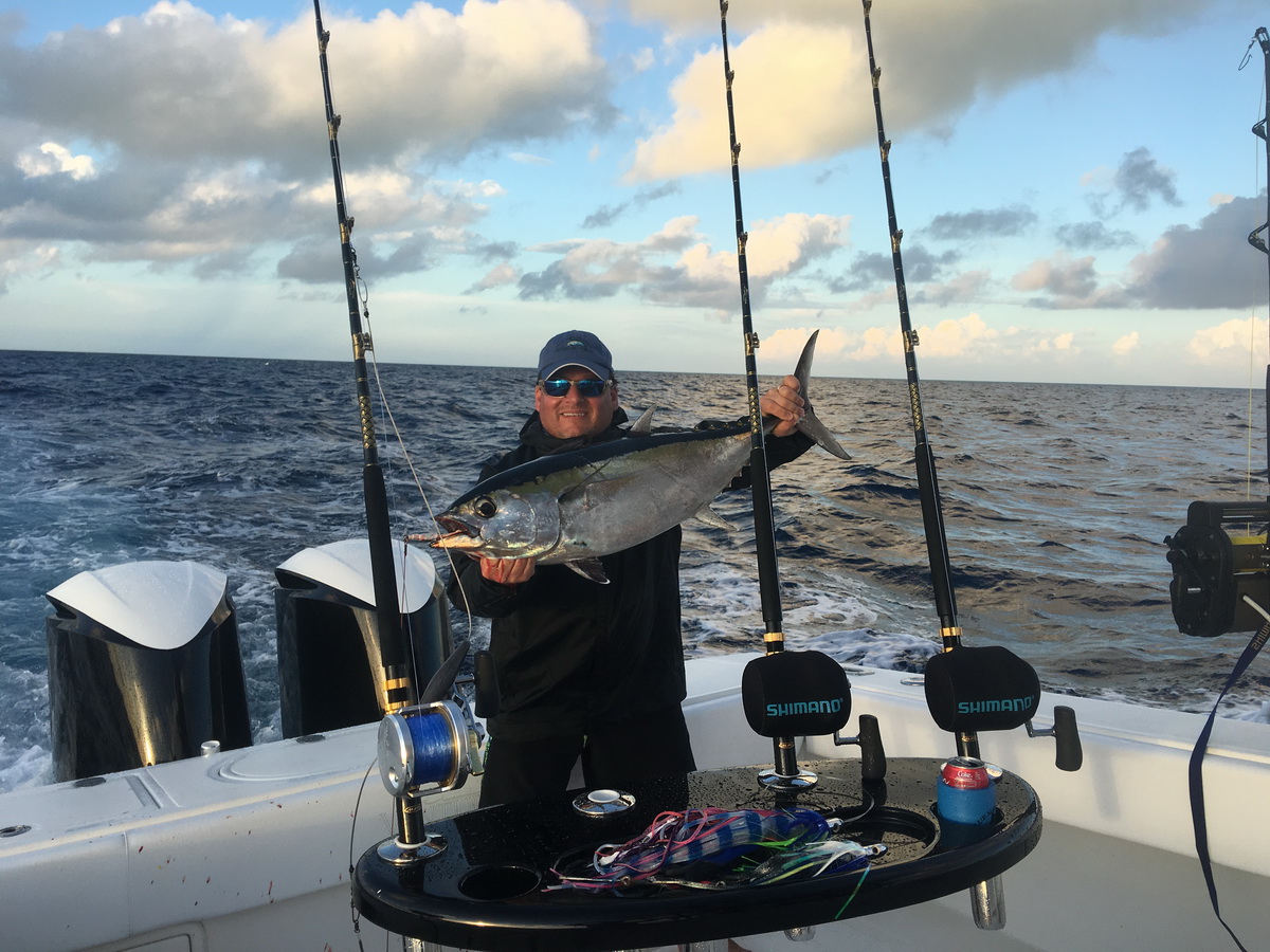 proud fisherman showing his catch